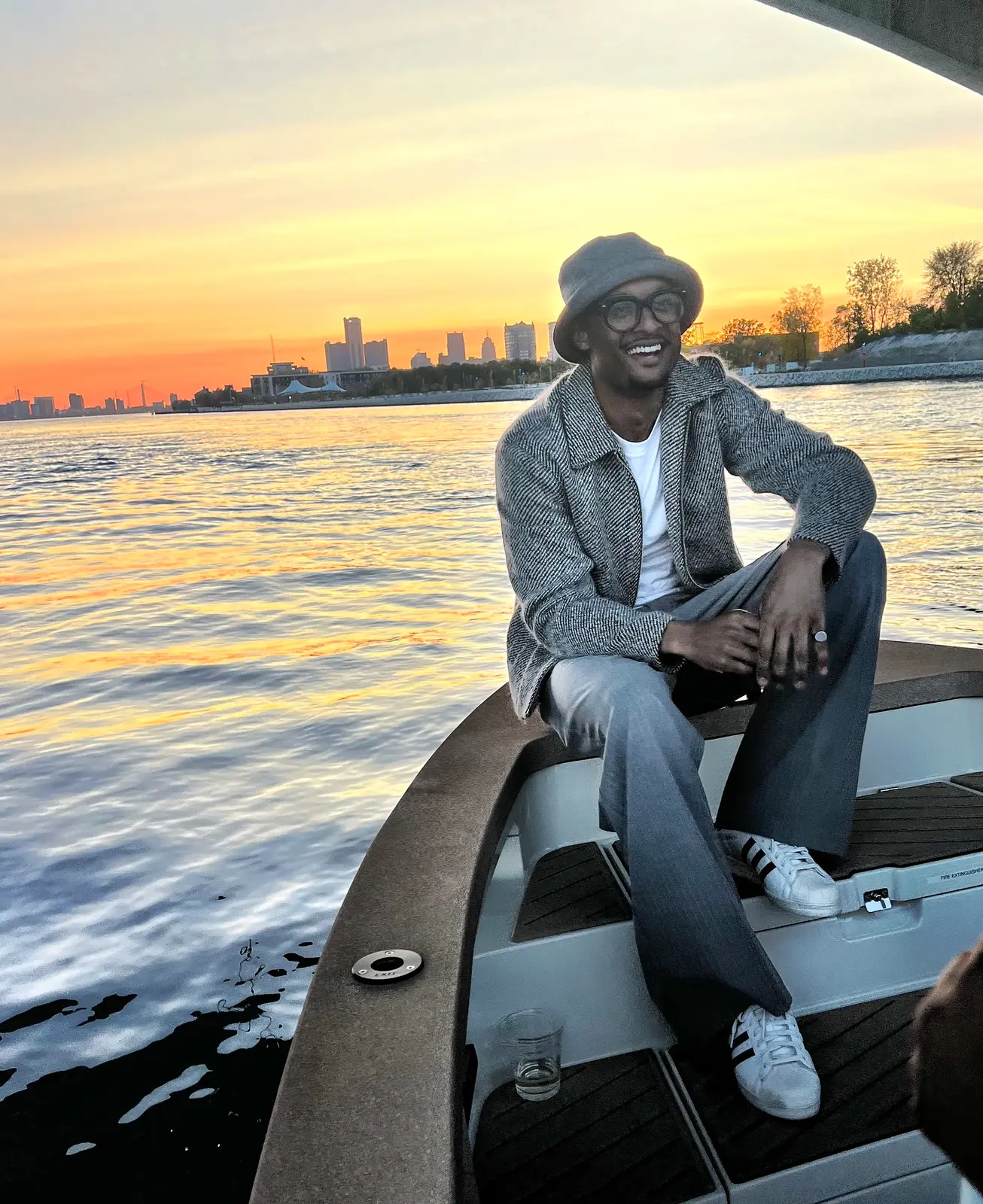 Guest relaxing on the bow of the Sycorax at sunset