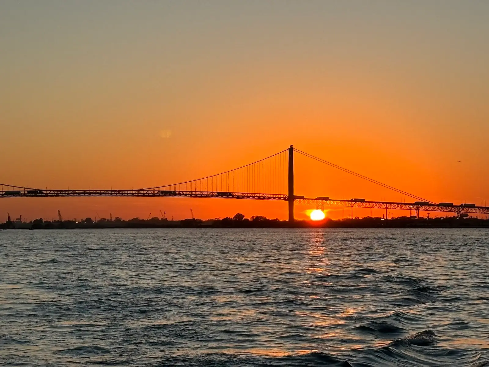 Ambassador Bridge at sunset over the Detroit River
